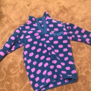 purple and blue polka dotted Patagonia jacket